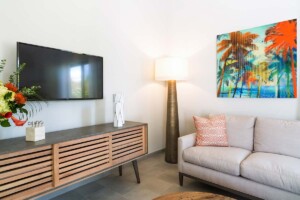 Living room with TV at Tradewinds villa